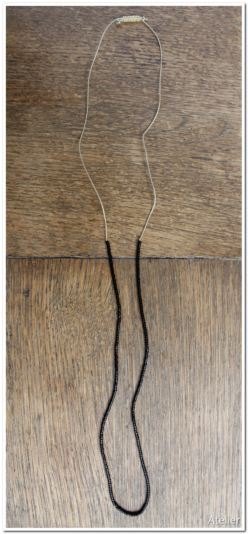 Fine Black Bead Necklace handmade in South America. Sits on delicate